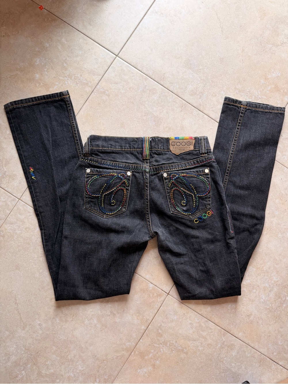 Coogi black straight jeans with rainbow details
Size 7/8
Inseam 32"